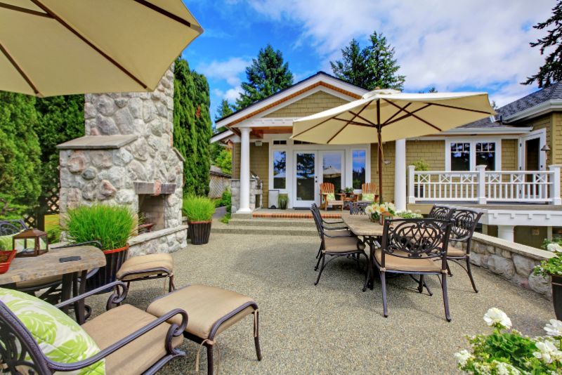 spacious patio with sitting area and a fireplace