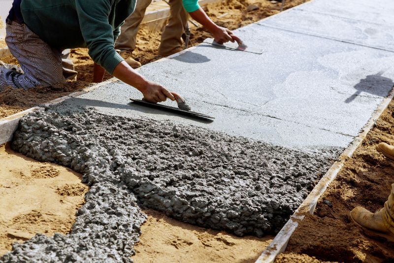 concrete laying on a driveway